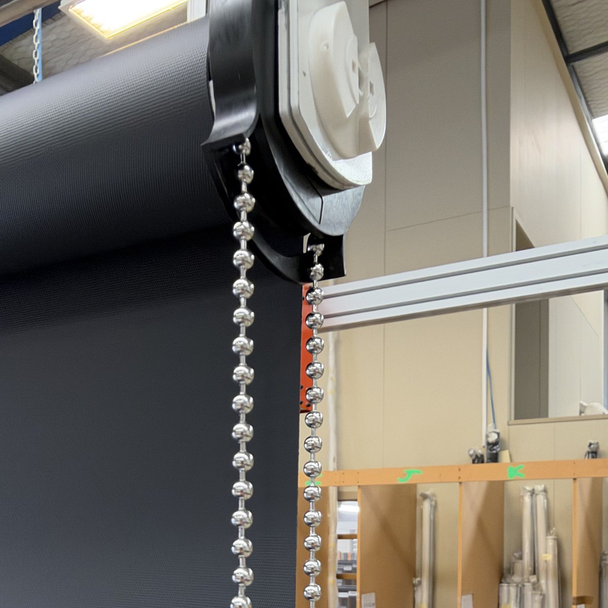 Stainless steel loop chain on a roller blind